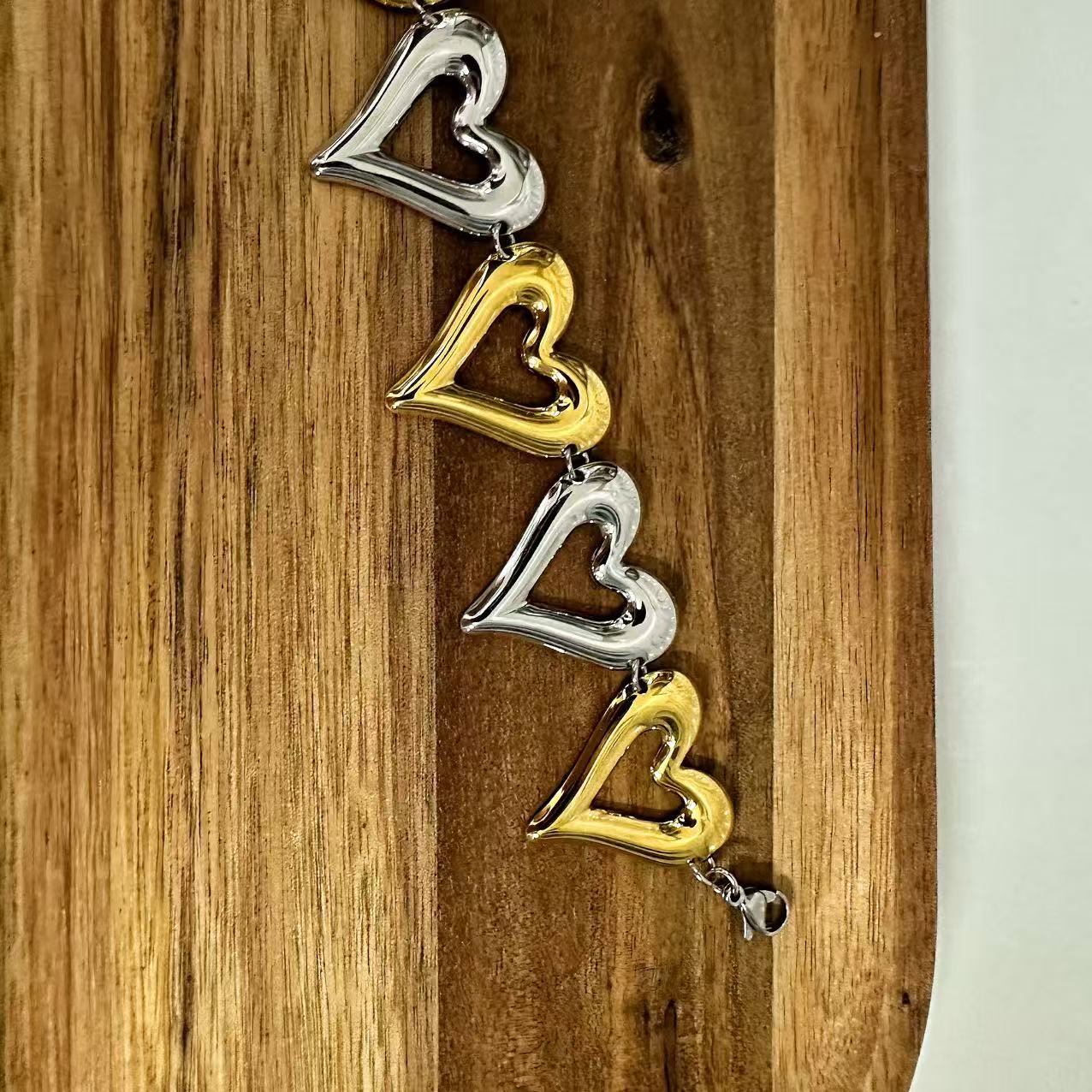 (B071) BRACCIALE DONNA BICOLORE CUORI IN ACCIAIO INOX