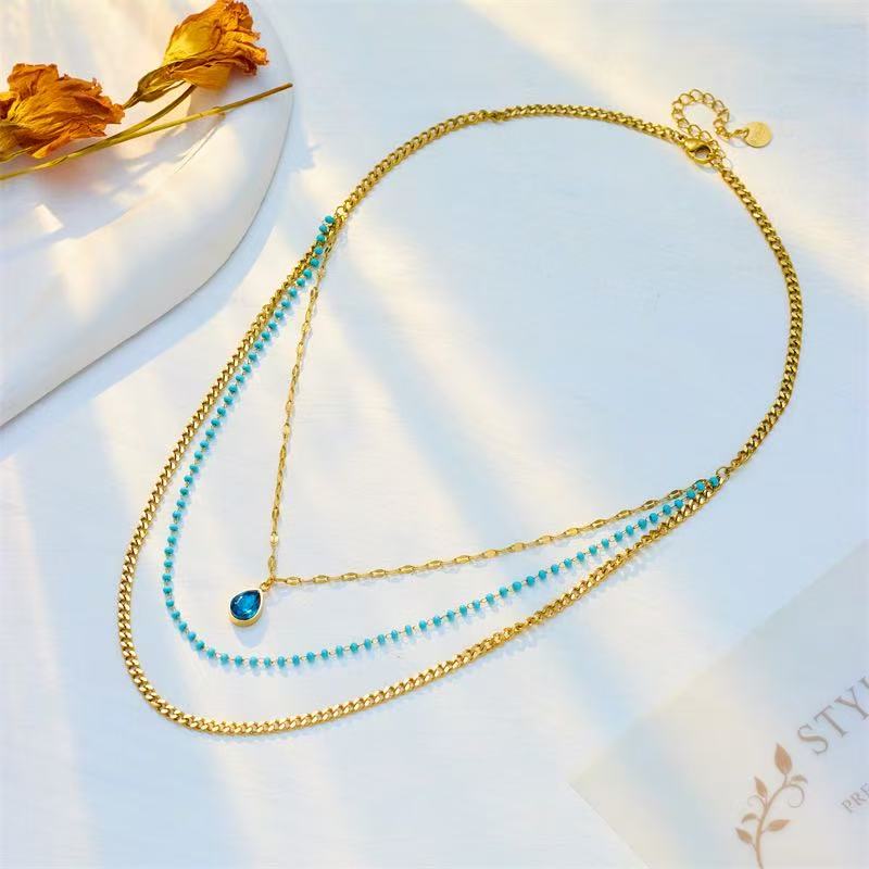 Collana Multistrato Dorata con Perline Turchesi