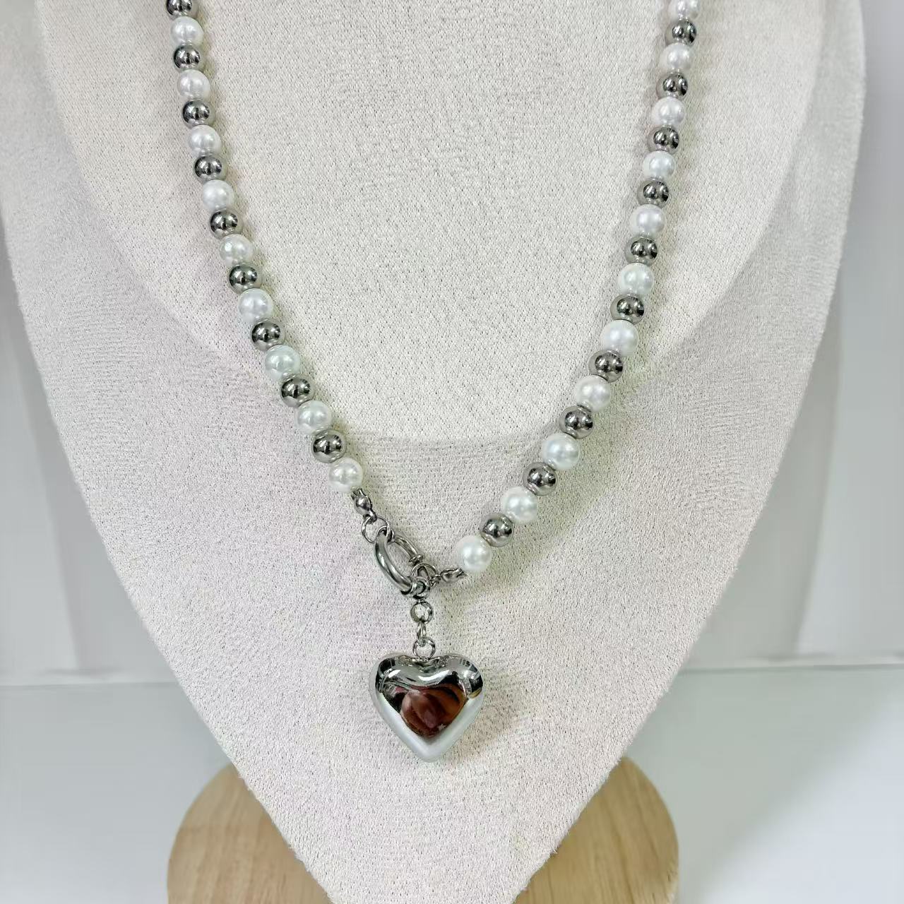 (C219)Collana bicolore con cuore bombato in acciaio inox