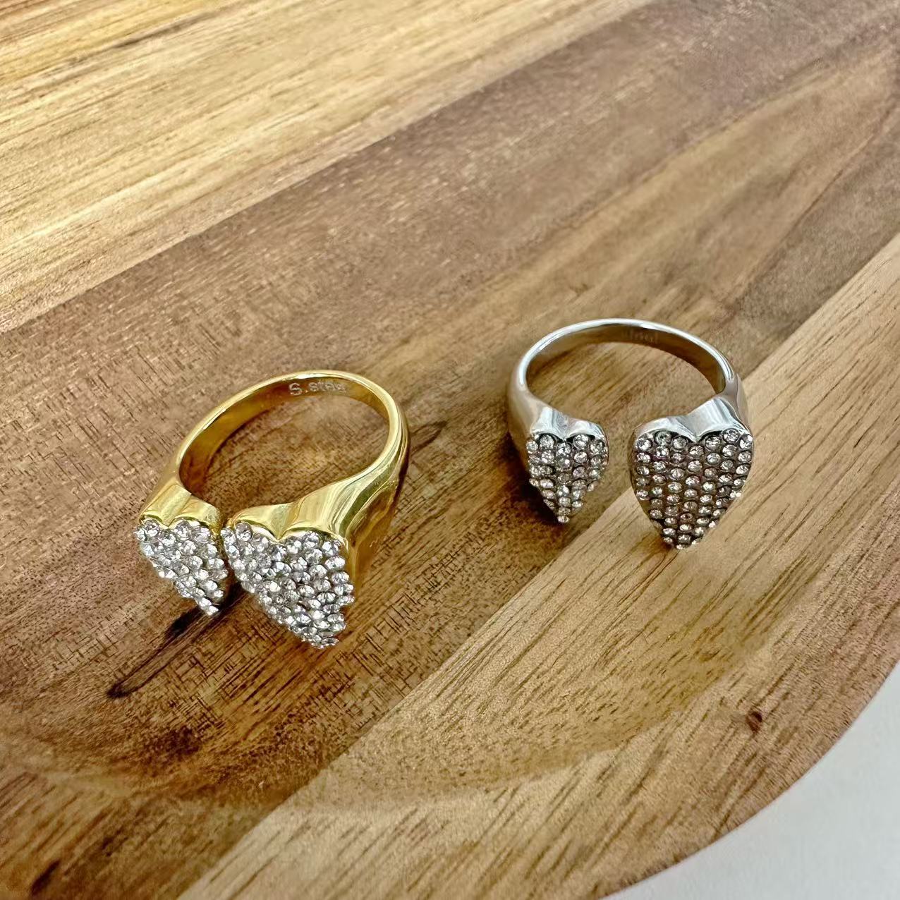 (A100)Anello due cuori con pavé regolabile in acciaio inox