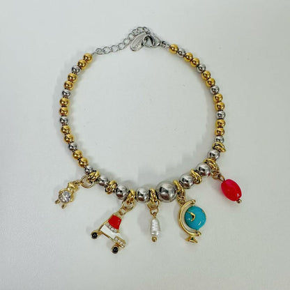 (B122)Bracciale bicolore in acciaio inox con tanti ciondoli