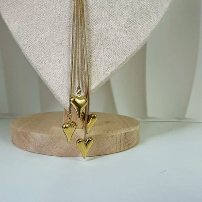 (C122)Collana lunga saliscendi con cuoricini a sonaglio in acciaio inox