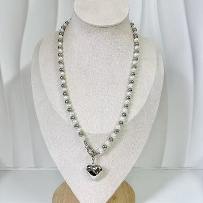 (C219)Collana bicolore con cuore bombato in acciaio inox