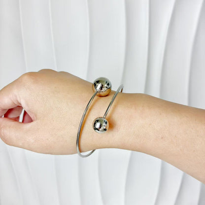 (B149)Bracciale semirigido donna con palline in acciaio inox