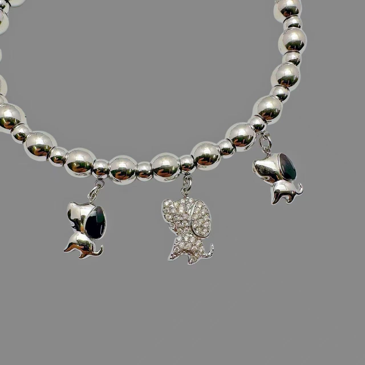 (B181)Bracciale semirigido con sfere e cagnolini