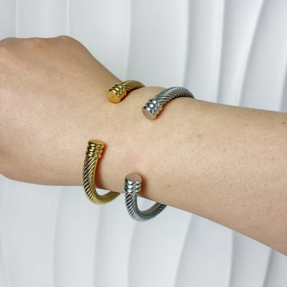 (B128)Bracciale semirigido donna intrecciato in acciaio inox