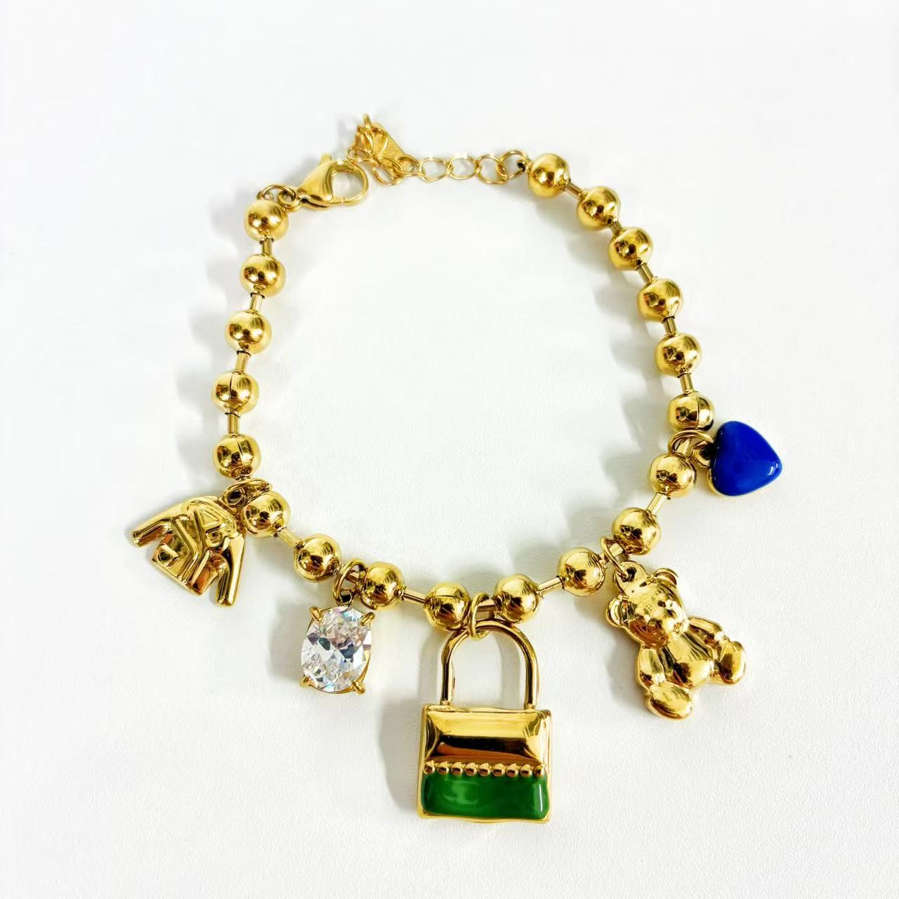 (B040) BRACCIALE DONNA CON PENDENTI IN ACCIAIO INOX