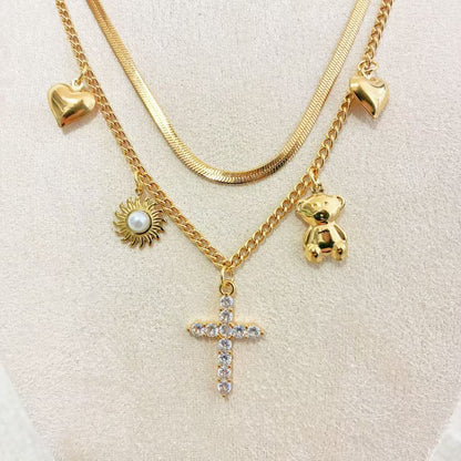 Collana Multistrato con Ciondoli Iconici – Stile Layering Moderno