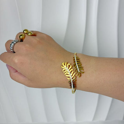 (B146)Bracciale rigido donna con molla foglie in acciaio inox