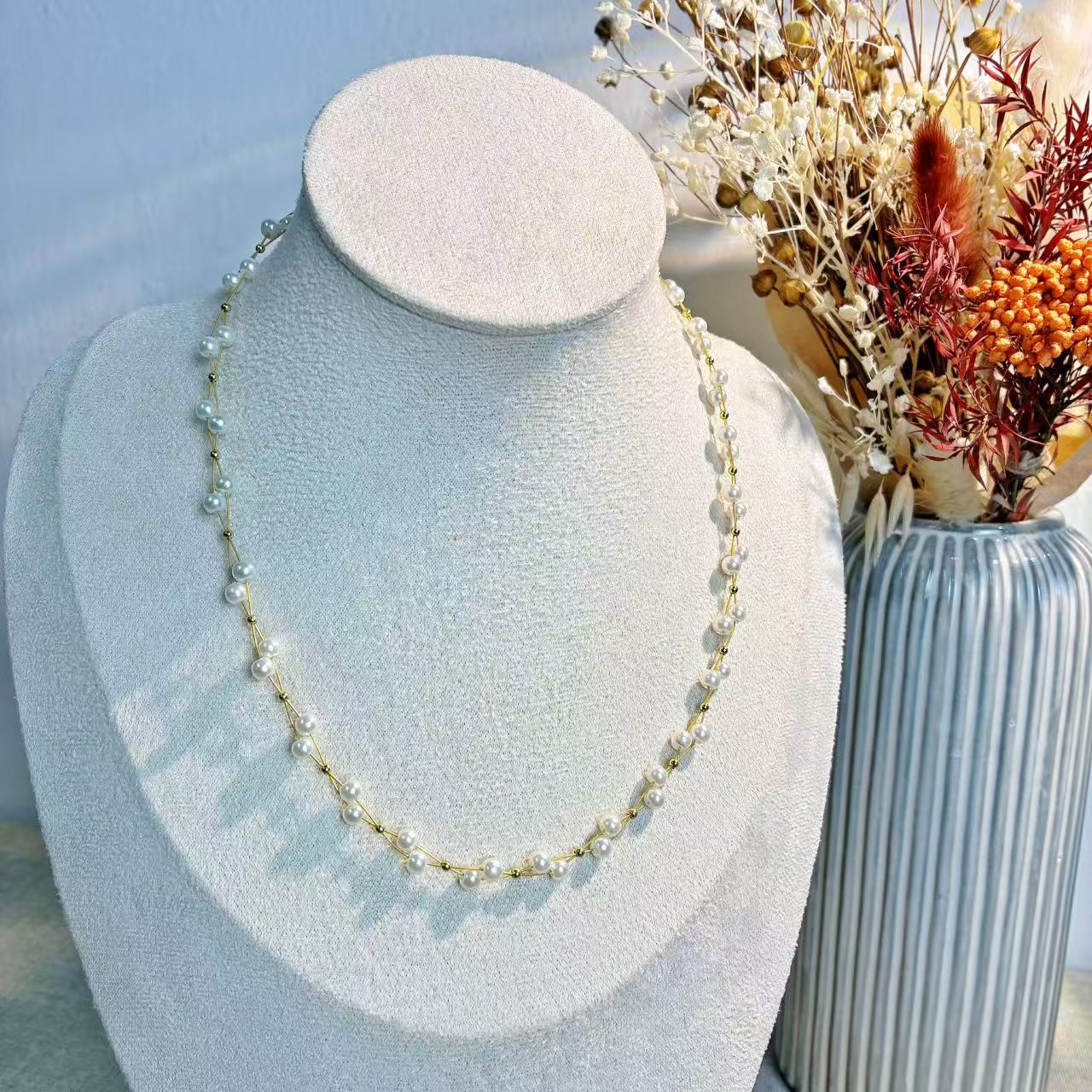 Collana “Perla Doppia” – Eleganza intrecciata