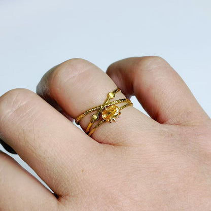 Anello a Fasce Intrecciate con Zircone Arancione – Acciaio Inossidabile