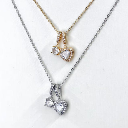Collana “Cuori Gemelli” – Romantica Brillantezza con Doppio Pendente