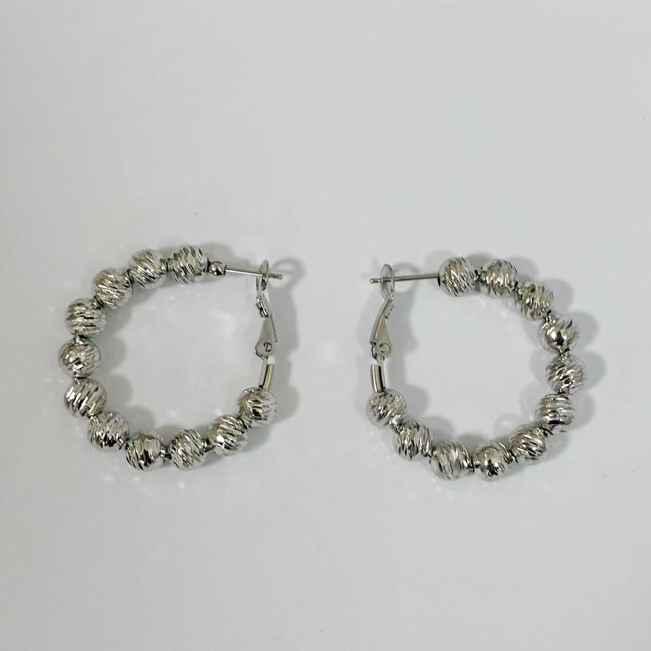 Orecchini “Cerchi Perla d’Acciaio”