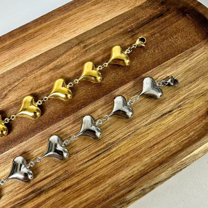 （B069) BRACCIALE DONNA CON CUORI IN ACCIAIO INOX