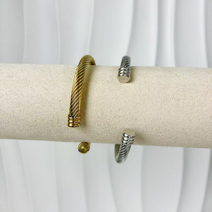 (B128)Bracciale semirigido donna intrecciato in acciaio inox