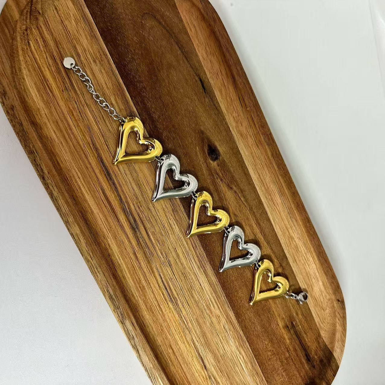 (B071) BRACCIALE DONNA BICOLORE CUORI IN ACCIAIO INOX