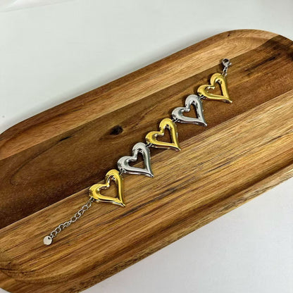 (B071) BRACCIALE DONNA BICOLORE CUORI IN ACCIAIO INOX