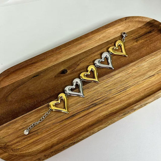 (B071) BRACCIALE DONNA BICOLORE CUORI IN ACCIAIO INOX