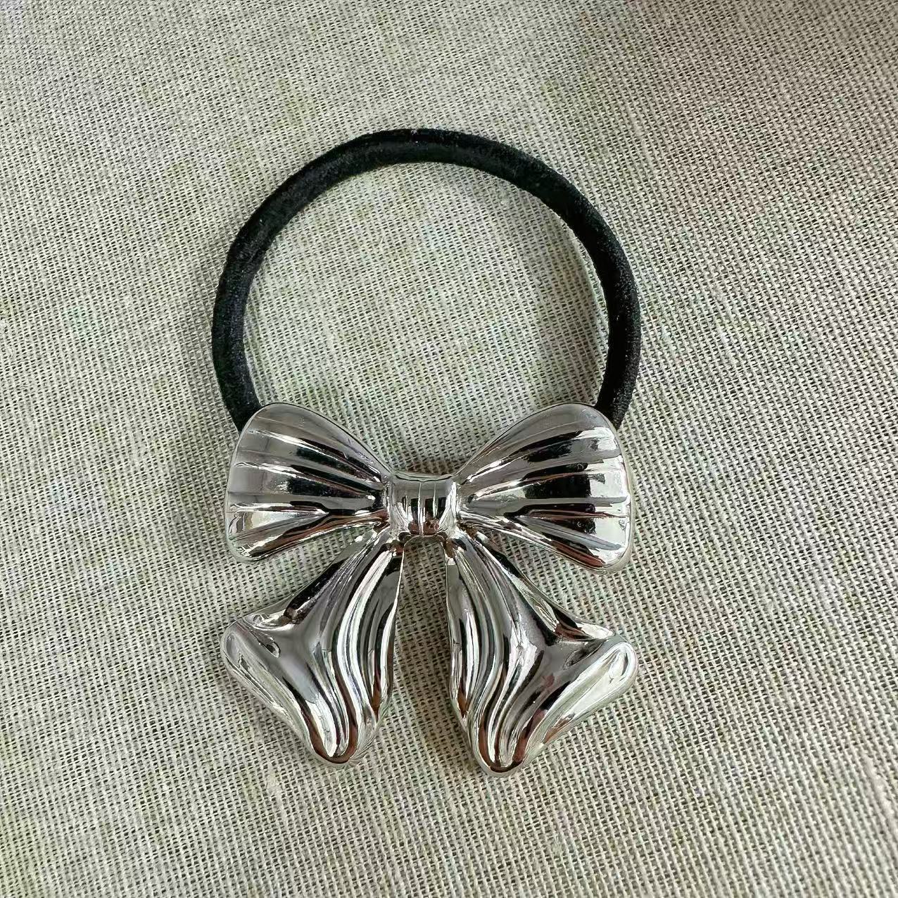 Elastico per capelli con fiocco scultoreo