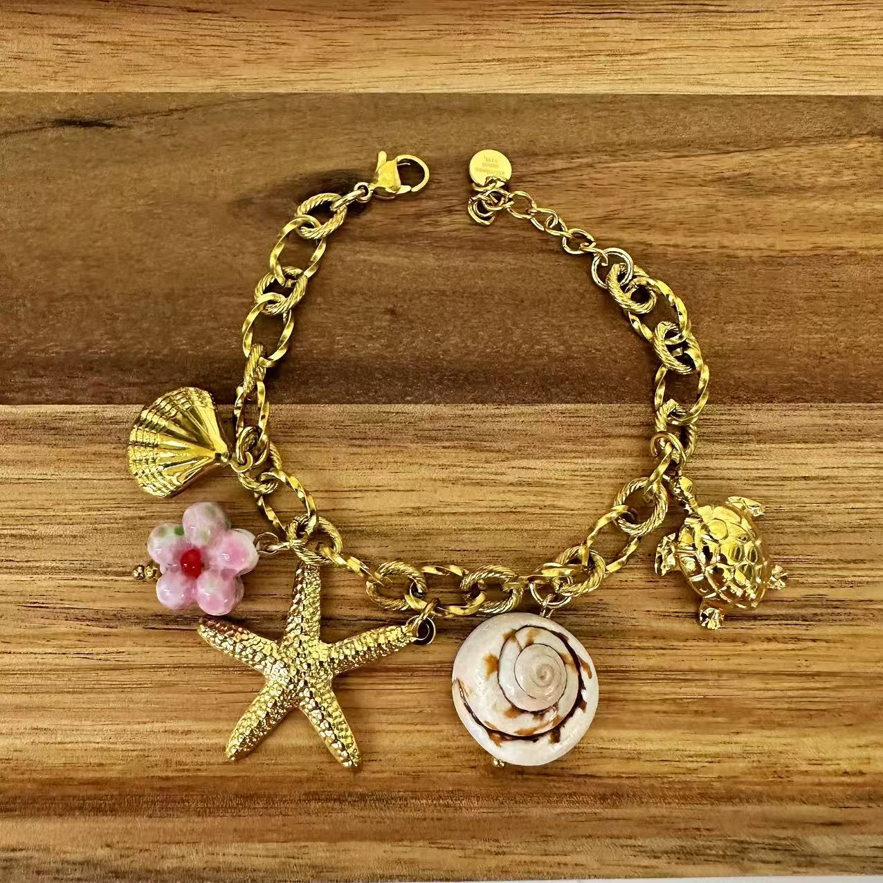 (B076) BRACCIALE DONNA CON PENDENTI IN ACCIAIO INOX