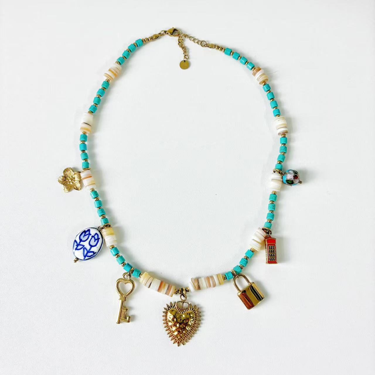 (C259)Collana con tanti pendenti in acciaio inox