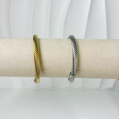 (B128)Bracciale semirigido donna intrecciato in acciaio inox