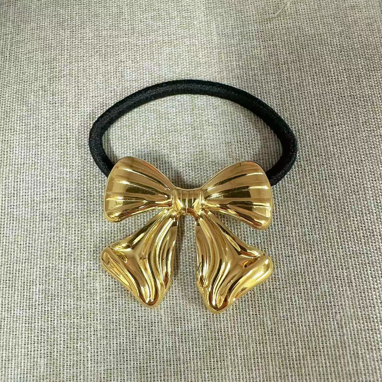 Elastico per capelli con fiocco scultoreo