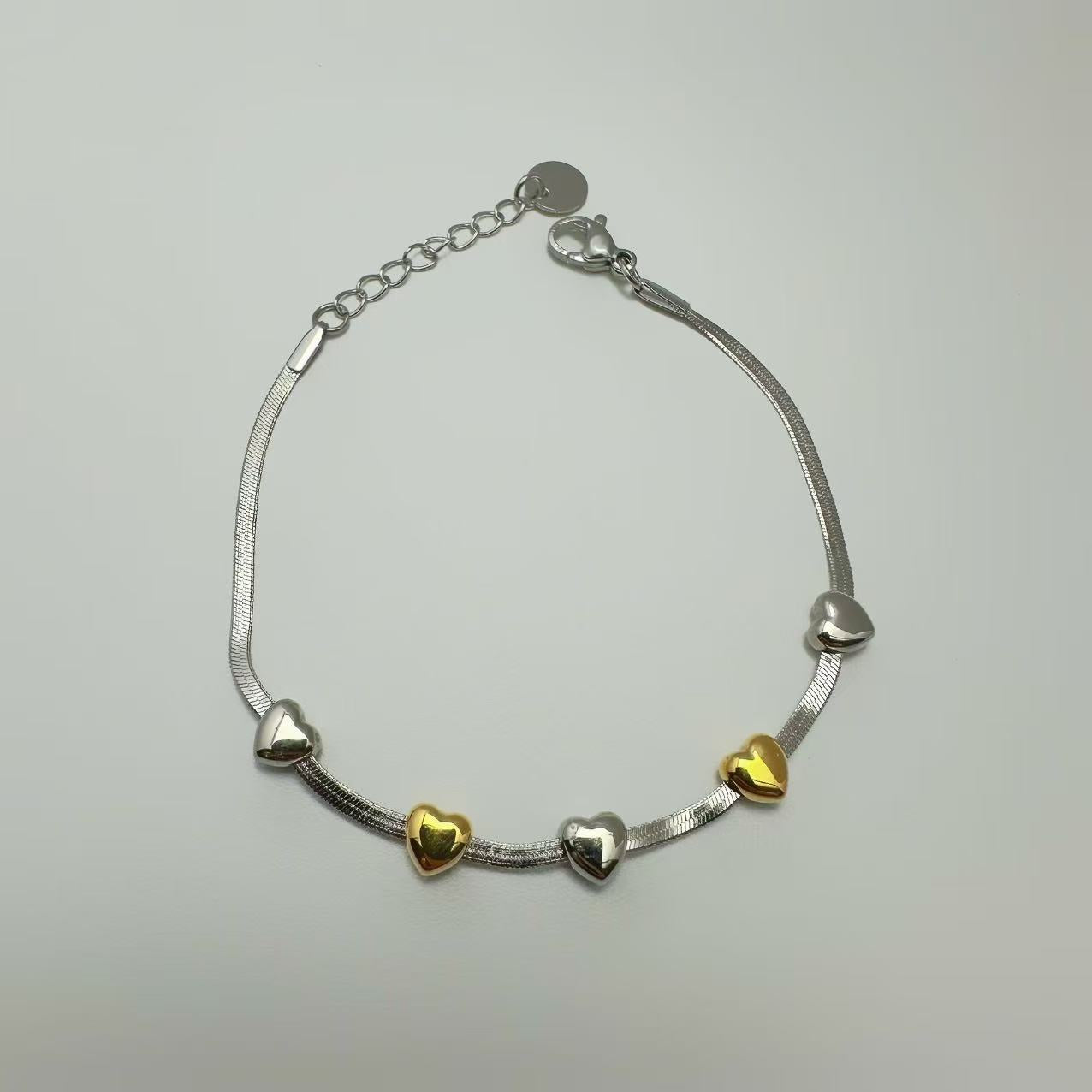 (B173)Bracciale cuoricini bicolori