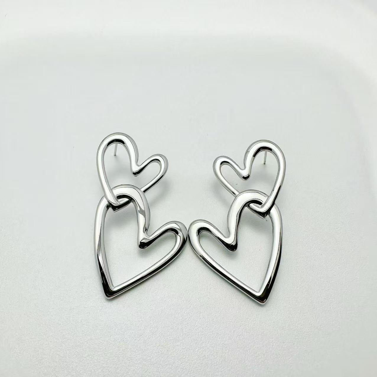 (O084)Orecchini doppio cuore in acciaio inox