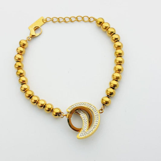 Bracciale con Sfera Lucida e Ciondolo Lunare Pavé – Stile Moderno Elegante