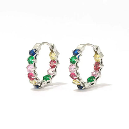 Orecchini "Infinity Glow" – Cerchi Intrecciati con Castone di Luce