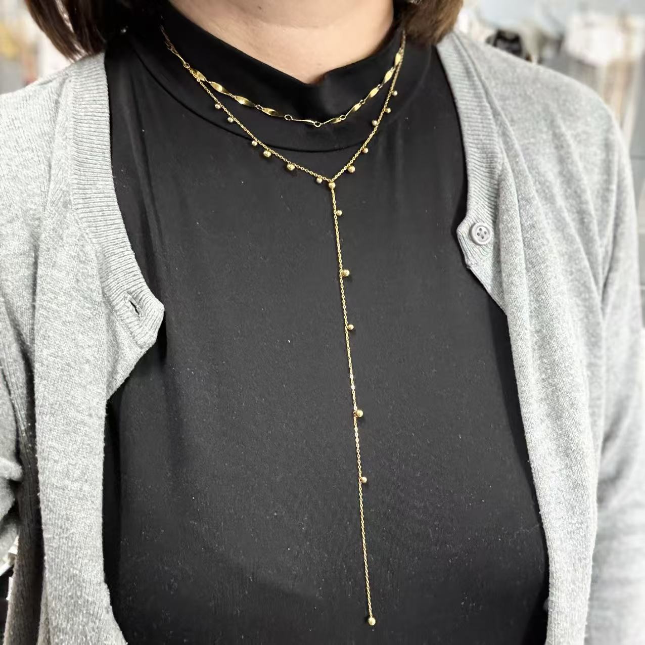 Collana palline con pendente lungo