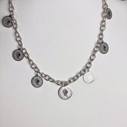 Collana “Monete Vintage” – Charme Retrò in Acciaio Moderno