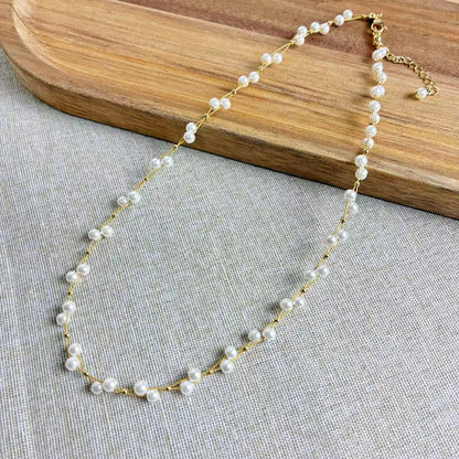 Collana “Perla Doppia” – Eleganza intrecciata