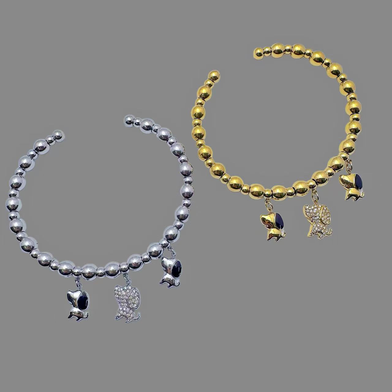 (B181)Bracciale semirigido con sfere e cagnolini