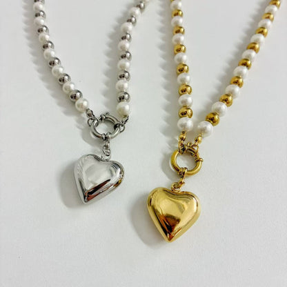 (C219)Collana bicolore con cuore bombato in acciaio inox