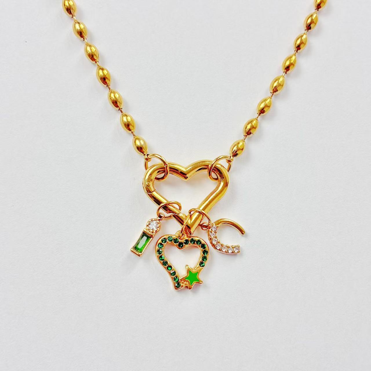 Collana “Emerald Heart Charms” – Cuore, Luna &amp; Stella
