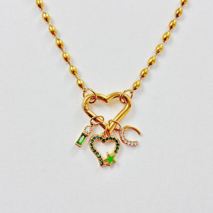 Collana “Emerald Heart Charms” – Cuore, Luna &amp; Stella