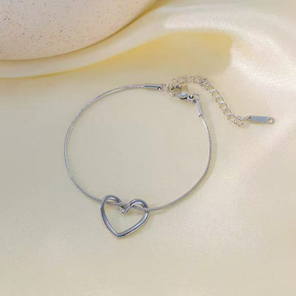 Bracciale "Nodo d'Amore" – Maglia Snake con Cuore Intrecciato
