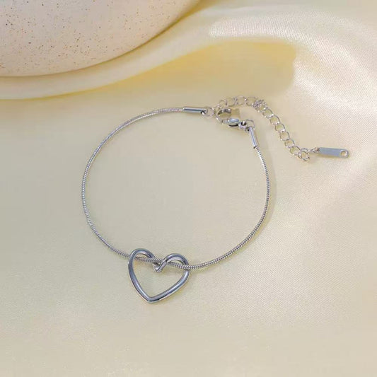 Bracciale "Nodo d'Amore" – Maglia Snake con Cuore Intrecciato
