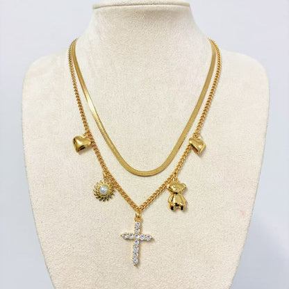 Collana Multistrato con Ciondoli Iconici – Stile Layering Moderno