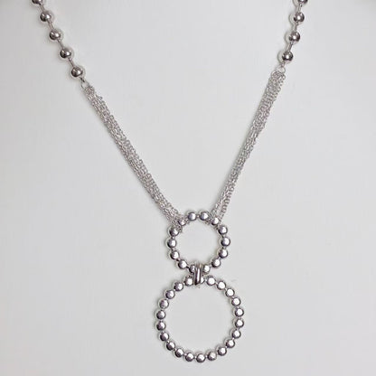 Collana “Doppio Cerchio Luminoso” – Geometria Elegante in Oro Moderno