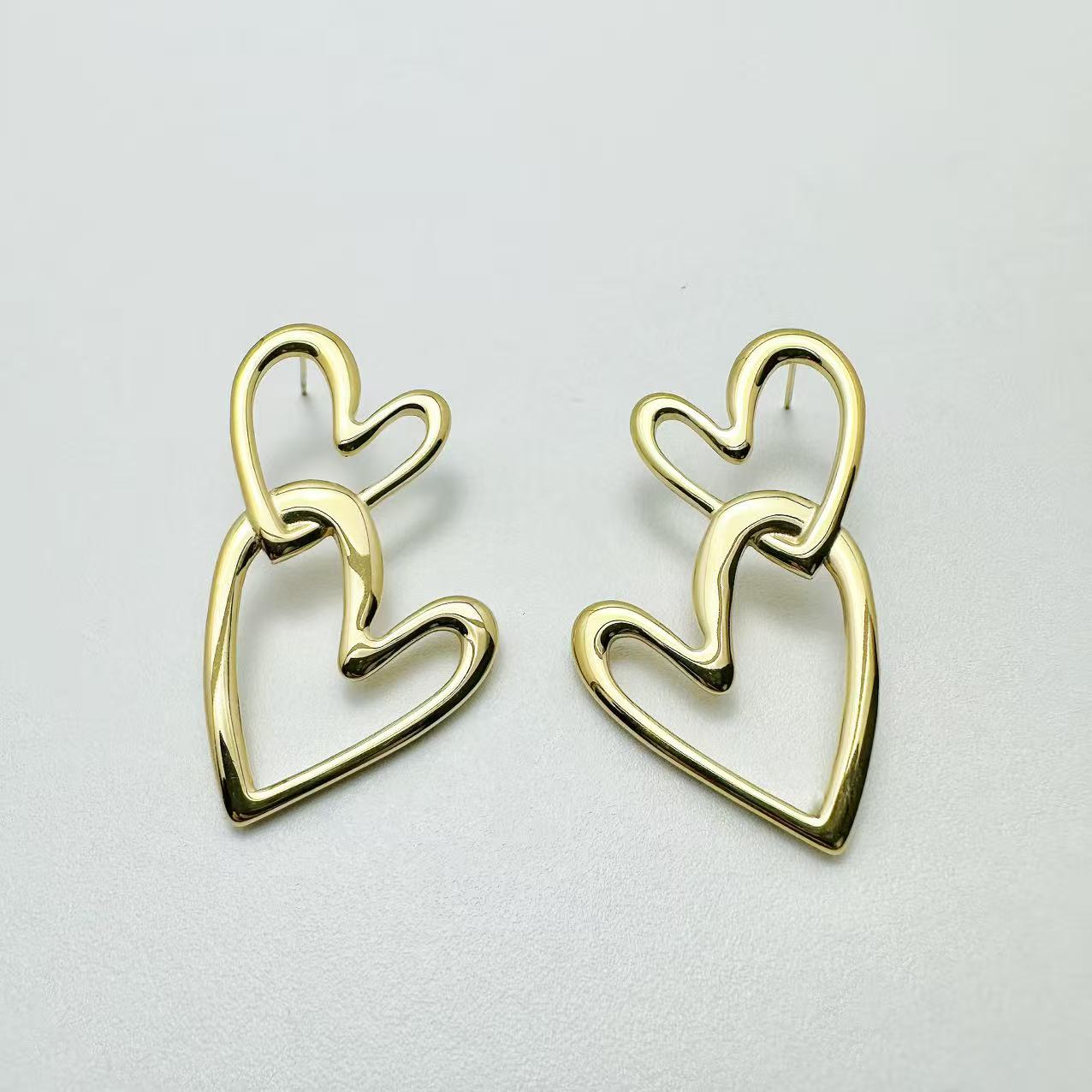 (O084)Orecchini doppio cuore in acciaio inox